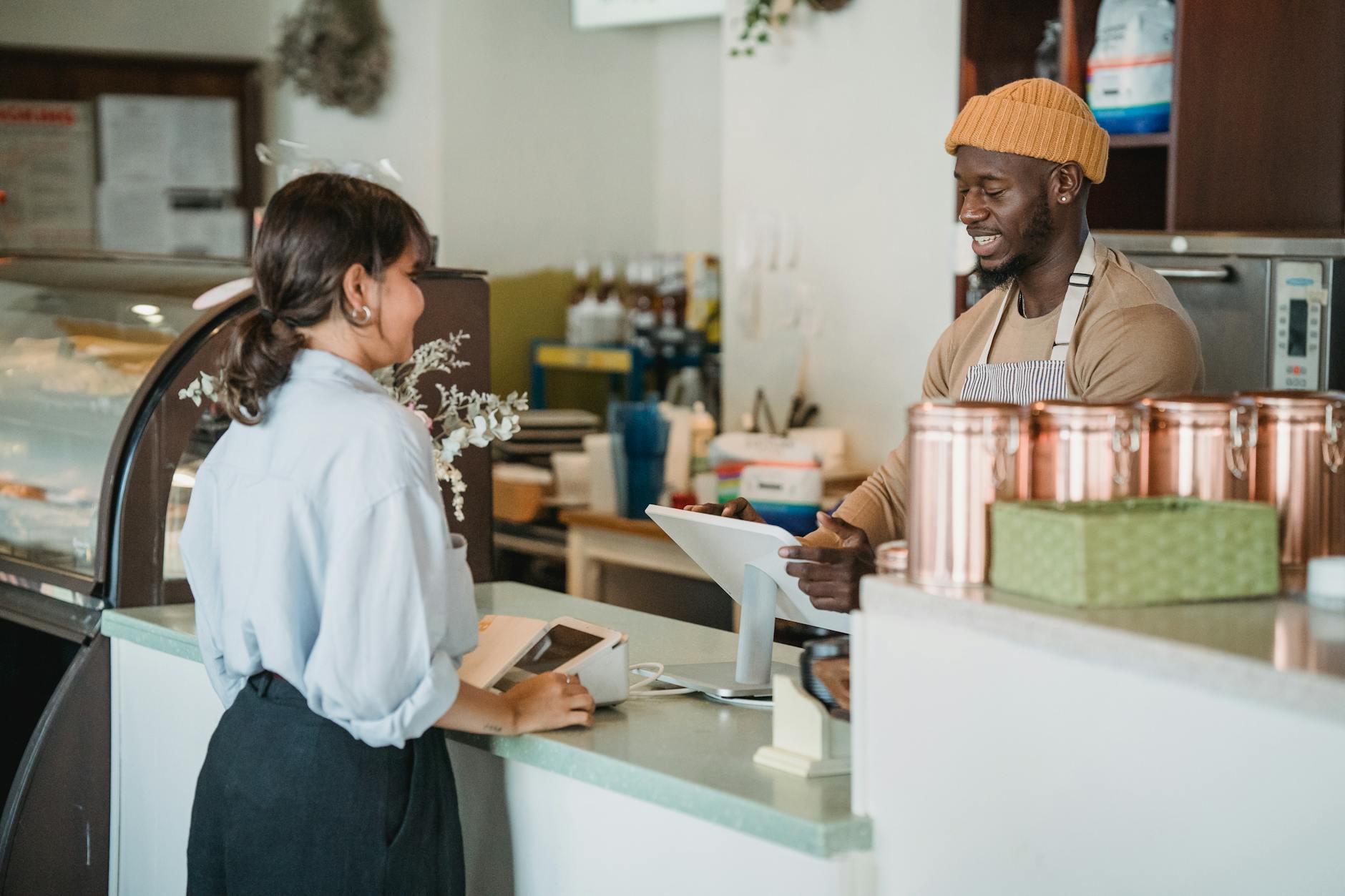 woman ordering coffee in cafe